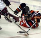 Colin Chaulk is tripped and hits the ice, but is still able to make the backwards pass and get an assist on the team's second goal of the night against the Motor City Mechanics during a 2004-05 regular season game at Memorial Coliseum. (News-Sentinel file photo)