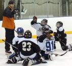 Komet Colin Chaulk works with some young hockey players in December 2007 at Hires Auto Parts on South Anthony Boulevard. (File photo by Ellie Bogue of The News-Sentinel)