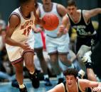 Bishop Dwewnger's Brendan Carretta watches as North Side's Keion Brooks takes off with the ball after knocking it from Carretta during the 1995 sectional finals at Memorial Coliseum. Brooks had 13 points as North Side defeated Bishop Dwenger 76-61 to win the program's third sectional title in four years.