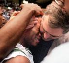 South Side boys basketball coach Gregg Taylor hugs Ryan Norfleet after the team won the 1997 sectional championship at Memorial Coliseum. South Side defeated Wayne 63-62 in the championship game after Cameron Stephens made a 25-foot game-winning jump shot as time expired. This was also the final year of the single-class postseason format for high school basketball.