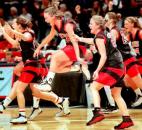 Bishop Luers players rush the floor to celebrate as time runs out in the 1999 Class 2A state championship game against Austin at then-Market Square Arena in Indianapolis. Bishop Luers defeated Austin 59-48 for its first state championship in program history. In addition, the Knights became the first Fort Wayne area school to win a state championship during the class basketball era. News-Sentinel file photo