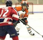 Fort Wayne's Colin Chaulk looks to slip the puck past a Kalamazoo Wings defender during an exhibition game in October 2002 at McMillen Ice Arena. (News-Sentinel file photo)