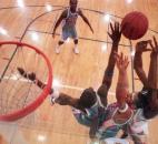 Wayne's Emanuel Wilson and Mike Corley battle Concordia Lutheran's Andre Patterson for a rebound during the second half of the 2000 Class 3A sectional finals. Patterson had a game-high five blocks and 18 points, including 11 points in the fourth quarter, as Concordia defeated Wayne 57-56 for its first sectional title in more than 10 years.