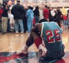 Wayne's Vessie Pirtle sits on the baseline after the Generals lost to Concordia Lutheran in the last minute of the 2000 Class 3A sectional finals. After making a potential game-winning basket with one second remaining, Wayne fouled Concordia's Andre Patterson on a court-long in-bounds pass. Patterson made both free throws to give Concordia a 57-56 victory.