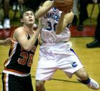 Carroll's Seth Lochmueller soars to the basket against Warsaw in the opening round of the 2002 sectional. Lochmueller was forced to leave the game just before the half after hitting his head on the hardwood and didn't return. Warsaw went on to knock off the defending sectional champion Chargers.