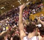 DeKalb's Adam Liddell and his teammates are rushed by fans after winning the 2003 Class 4A sectional championship against Columbia City in double overtime. In the matchup between two top-10 teams, DeKalb rallied from an 11-point fourth-quarter deficit to force overtime. Alex Kock led DeKable with a game-high 24 points and 14 rebounds, including scoring all 10 of the Baron's points in double overtime.