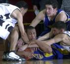 Kevin Mitchell attempts to hang on to the ball as Snider players try to wrestle it from his grasp in the fourth quarter of Homestead's victory in the 2003 Class 4A sectional opening round. Homestead reached the sectional finals but lost to Northrop, which won its first sectional championship since 1987.  