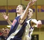 Bellmont's Aaron Richie loses control of the ball after a Leo defender fouled him during the 2004 Class 3A sectional finals. Bellmont defeated Leo on its home court to win the sectional title and would advance to the state championship game before losing to Evansville Mater Dei.