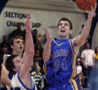 Blackhawk Christian's Andrew Walker powers past Justin Swanson of Canterbury in the 2005 Class A sectional opening round. Blackhawk Christian defeated Canterbury 72-42 and would go on to win the sectional title -- the third of six consecutive sectional championships the program won during the 2000s.  