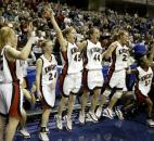 Bishop Luers players celebrate after beating Evansville Memorial 65-54 in the 2006 Class 3A state finals at then-Conseco Fieldhouse. Sophomore Amanda Pedro in the victory had a double double with 13 points and 14 rebounds, while Kelsey Wyss added a game-high 21 points to help the Knights win their fifth state title in program history. News-Sentinel file photo