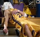 Aaron Brown waits for Angola's trainer to work on the bloody nose he suffered in the first half of the Hornets' 61-48 loss to Concordia Lutheran in the 2008 Class 3A sectional. Angola has not won a sectional championship since 1999.