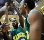 Harding's DaVon Washington and Michael Stevenson celebrate after receiving the Class 3A sectional trophy. Harding, after receiving a first-round bye, defeated Bishop Dwenger in the semifinals and Leo in the finals to earn its final sectional title in program history before the school closed later that year.