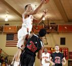 Northrop's Bryson Scott, left, leaps to take a shot in the third quarter of the Bruins' 95-59 win over Bishop Luers on Jan. 11 at Northrop.
