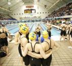 Homestead's 200-yard freestyle relay team hugs before the start of their heat race in the IHSAA state preliminaries Feb. 8 at the IUPUI Natatorium. (Photo by Chad Ryan/INMedia Source)