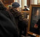 Mourners signed the visitors book before paying their respects to the late Bishop John D'Arcy during visitation Feb. 7 at the Cathedral of the Immaculate Conception. (Photo by Ellie Bouge of The News-Sentinel)