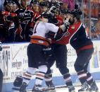 Komets forward Colin Chaulk mixes it up with a couple of Port Huron players during the team's 2009 playoff game with Port Huron. The Komets won 7-2, keeping their Turner Cup hopes alive. (News-Sentinel file photo)