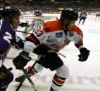 Eric Giosa, right, skates out of the grasp of Orlando's Sean Lorenz behind the Solar Bears' net in the third period of the Komets' 3-2 win Jan. 5 at Memorial Coliseum.