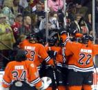 The Komets mob Colin Chaulk after his game-winning overtime goal against the Rapid City Rush during the 2012 Turner Conference semifinals. The Komets won 4-3 to win the series in six games. (News-Sentinel file photo)