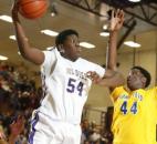 New Haven's Steve McElvene snatches an offensive rebound away from Homestead's Caleb Swanigan during the first quarter of the Bulldogs' 82-70 win against Homestead on Feb. 2 at New Haven. (Photo by Chad Ryan/INMedia Source)