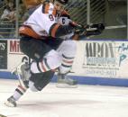 Komets forward Colin Chaulk leaps a poke-check attempt and keeps his eye on the puck during the second period of the Komets' first-round playoff game against Port Huron in April 2003. (File photo by Ellie Bogue of The News-Sentinel)