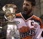 Captain Colin Chaulk accepts the Colonial Cup for the Komets in 2003. The Komets beat the Quad City Mallards to win the 2003 UHL championship. (News-Sentinel file photo)