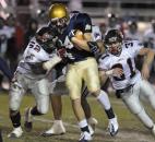 Lowell's defense tries to stop Bishop Dwenger's Tyler Eifert during the 2008 class 4A semistate game at Zollner Stadium. Eifert had a 76-yard kickoff return for a touchdown and a fourth-quarter touchdown reception to lead Bishop Dwenger past Lowell 38-22 and into the state championship game. (News-Sentinel file photo)