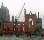 A clam-shell bucket takes the first bite during demolition of the fire-ravaged building. News-Sentinel file photo