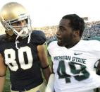 Notre Dame's Tyler Eifert and Michigan State's TyQuan Hammock meet up on the field after their game in 2011. The two players were rivals at college afer being rivals at the high school level in Fort Wayne, with Eifert coming from Bishop Dwenger and Hammock coming from Bishop Luers. (News-Sentinel file photo)