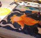Madison Aschliman, an artist at the Fort Wayne Museum of Art's Chalk Walk at the Fort Wayne Newspapers Three Rivers Festival and junior at Snider High School, based her design upon the movie "Rise of the Guardians". (Photo by Jaclyn Goldsborough of The News-Sentinel)