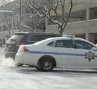 A Fort Wayne Police car stands broadside in traffic early Monday afternoon to protect two cars involved in a wreck. The two cars had collided at the intersection of East Washington Boulevard and South Clinton Street. (Photo by Ellie Bogue of The News-Sentinel).