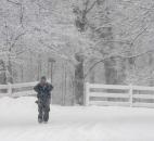 A Sunday morning walker at Foster Park was one of the few to brave the snow for a loop around the golf course. (Photo by Ellie Bogue of The News-Sentinel).