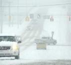 Traffic on Hillegas Road at the Jefferson Boulevard intersection was moving slowly as roads became increasingly slick with the heavy snowfall early Sunday afternoon. (Photo by Ellie Bogue of The News-sentinel).