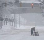 Calhoun Street was a ghost town Sunday afternoon except for a few brave souls trying to get ahead on the snow cleanup. (Photo by Ellie Bogue of The News-Sentinel).