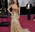 Catherine Zeta-Jones wore an  all-gold Zuhair Muhad gown. (From The Associated Press)