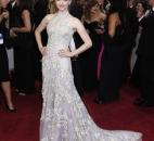 Amanda Seyfried's metallic halter dress by Alexander McQueen had a keyhole opening. (From The Associated Press)