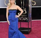 Reese Witherspoon wore a strapless royal-blue Louis Vuitton gown with a black strip at the bustline. (From The Associated Press)