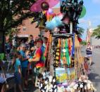 Shawn Devooght sold toys from a mobile cart during the Lutheran Health Network Three Rivers Festival Parade Saturday, July 13. For being the first year at the festival, Devooght said people were very receptive and excited for the mobile vendors. (Photo by Jaclyn Goldsborough)