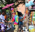 Nkinava Acoff, 14-years-old, bought a purple inflated monkey from Event Toys vendor Shawn Devooght. This was the first year for the mobile vendor in the Lutheran Health Network Three Rivers Festival Parade on July 13. (Photo by Jaclyn Goldsborough)