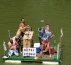 Members of a raft launch water balloons at spectators Saturday afternoon at the Fort Wayne Newspapers Three Rivers Festival Raft Race. Photo by Matthew Glowicki of The News-Sentinel