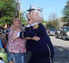 Tracey Graham of Hoagland hugs Admiral Andy as he walks by in the Lutheran Health Network Three Rivers Festival Parade Saturday, July 13. (Photo by Jaclyn Goldsborough)