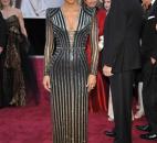 Actress Halle Berry, who was dressed by Donatella Versace, wore a silver beaded-and-black gown with long sleeves and V neck. (From The Associated Press)