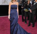Helen Hunt wore a blue column gown from fast-fashion retailer H&M because the gown is accessible and because the company has launched a substantial green initiative. (From The Associated Press)