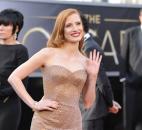 Jessica Chastain turned heads at the Oscar ceremony in a glistening copper-tone, strapless Armani gown with mermaid hem, which created the look of  an old-world glamorous movie star. (From The Associated Press)