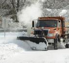 Fort Wayne street department crews were plowing in force Monday, despite the record cold. This plow was making its way up Old Mill Road, near the intersection with West Pettit Avenue. (Photo by Ellie Bogue of The News-Sentinel).