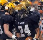 In the second quarter Bishop Dwenger's Gabriel Espinoza is congratulated by teammates after scoring a touchdown. 