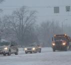 At Stellhorn and Reed roads a snowplow clears the road during the start of the snowstorm Monday evening. (Photo by Jaclyn Goldsborough of The News-Sentinel)