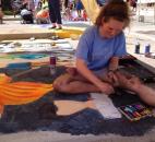 Madison Aschliman, an artist at the Fort Wayne Museum of Art's Chalk Walk at the Fort Wayne Newspapers Three Rivers Festival and junior at Snider High School, created her sidewalk art freehand, without a previous sketch. (Photo by Jaclyn Goldsborough of The News-Sentinel)
