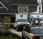 Two FBI agents take part in the search of a home Thursday morning in the 6600 block of Cherry Hill Parkway. The home belongs to Michael Fabini, brother of Fort Wayne native and former NFL player Jason Fabini. Photo by Christian Sheckler