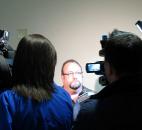 Allen County Councilman Paul Moss talks with reporters after the county's Ethics Commission dismissed a conflit-of-interest complaint against him Friday afternoon. Photo by Kevin Leininger