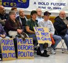 Attendees of Tuesday night's rally against right-to-work legislation listen to remarks by Angola Mayor Richard Hickman. More than 100 people attended the rally in Fort Wayne. Photo by Sarah Janssen